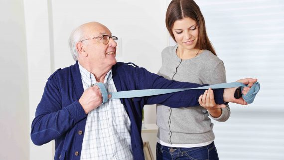 Old man at rehabilitation in physiotherapy